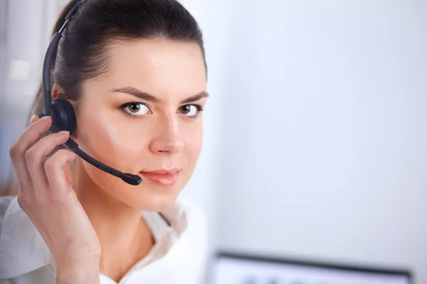 Close-up portrait of a customer service agent sitting at office — Stock Photo, Image