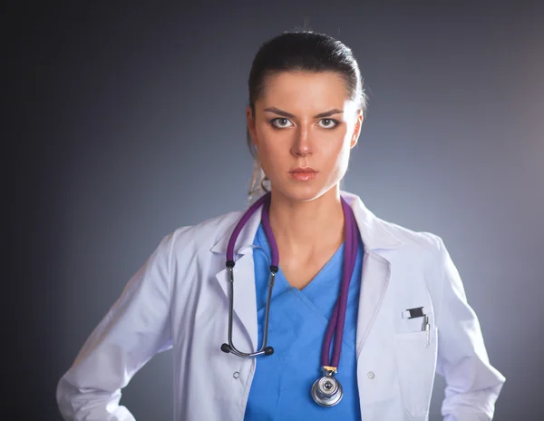 Young doctor woman with stethoscope isolated on grey — Stock Photo, Image