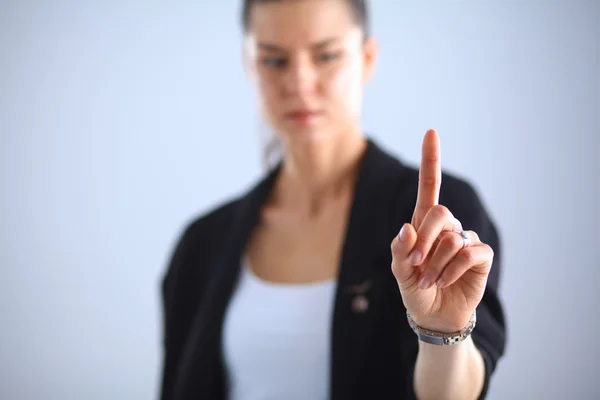 Frau berührt imaginären Bildschirm mit dem Finger — Stockfoto