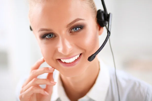 Close-up portrait of a customer service agent sitting at office — Stock Photo, Image