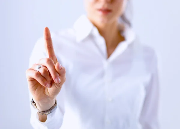 Mujer tocando una pantalla imaginaria con su dedo — Foto de Stock