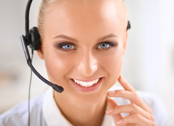 Close-up portrait of a customer service agent sitting at office — Stock Photo, Image