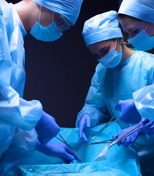 Team surgeon at work in operating room. — Stock Photo, Image