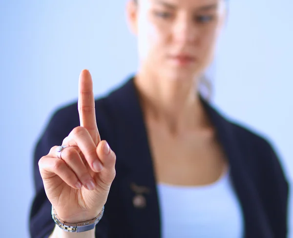 Vrouw die een denkbeeldig scherm aanraakt met haar vinger — Stockfoto