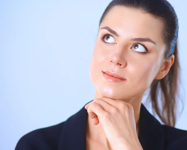 Junge Frau stehend, isoliert auf grauem Hintergrund — Stockfoto