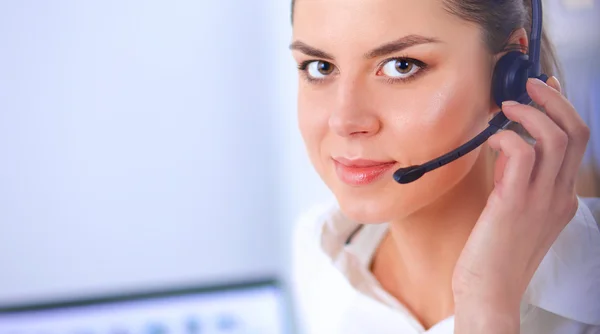 Close-up portrait of a customer service agent sitting at office Stock Picture