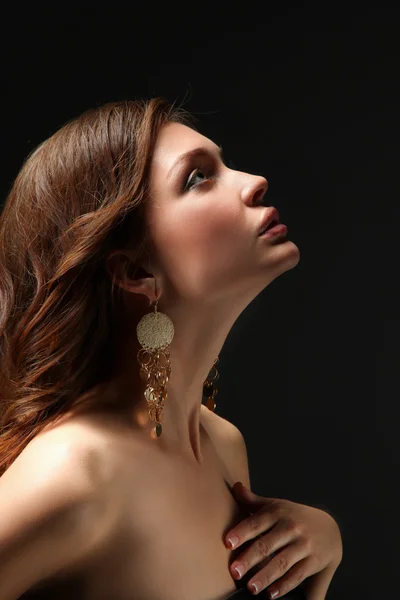 Portrait of beautiful young woman . Isolated on dark background — Stock Photo, Image