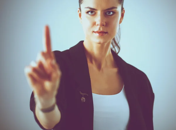 Woman touching an imaginary screen with her finger — Stock Photo, Image
