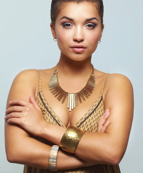 Young beautiful brunette woman with beads — Stock Photo, Image