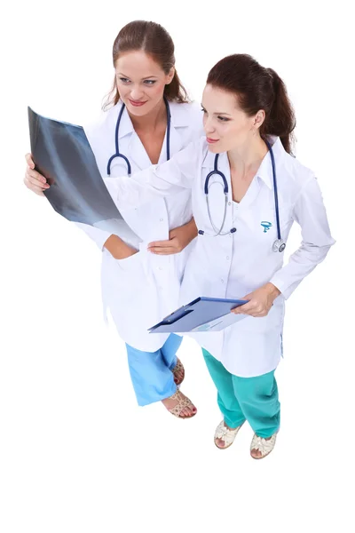 Two woman nurse watching X Ray image, standing in hospital — Stock Photo, Image