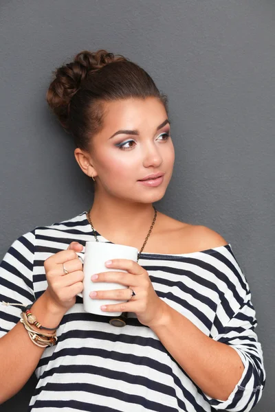 Portrait of young woman with cup tea or coffee — Stock Photo, Image