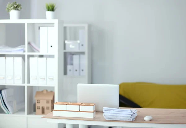 Modern office interior with tables, chairs and bookcases