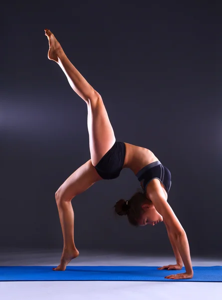 Portrait of sport girl doing yoga stretching exercise — Stock Photo, Image