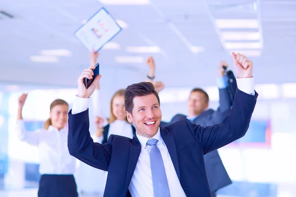 Business team celebrating a triumph with arms up — Stock Photo, Image