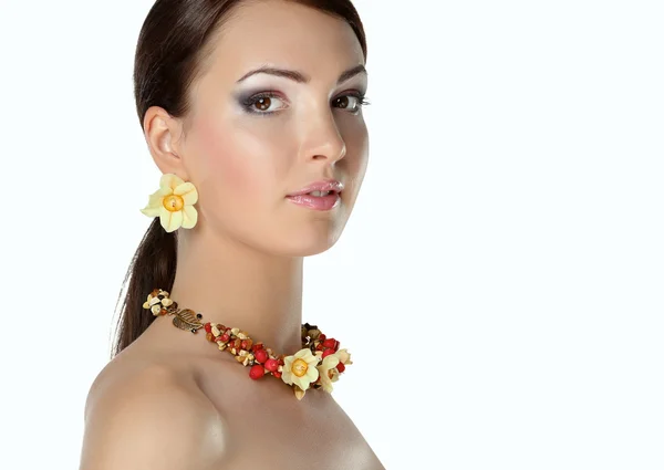 Portrait of young beautiful brunette woman in beads — Stock Photo, Image