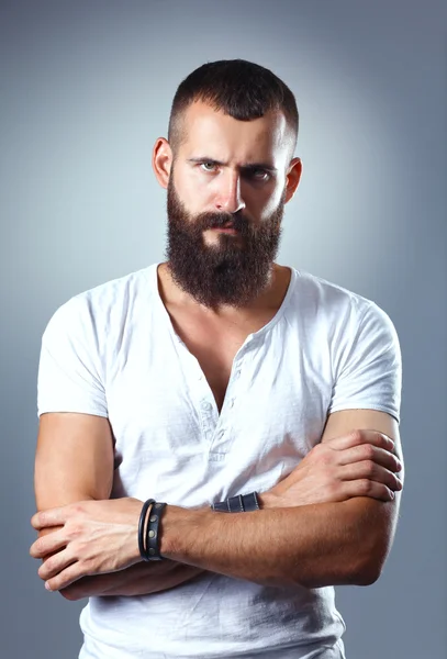 Portrait of handsome man standing, isolated on grey background — Stock Photo, Image