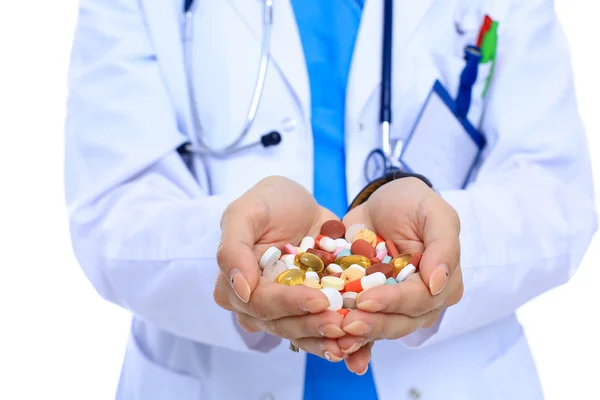 Médico segurando montão de drogas em uma mão — Fotografia de Stock