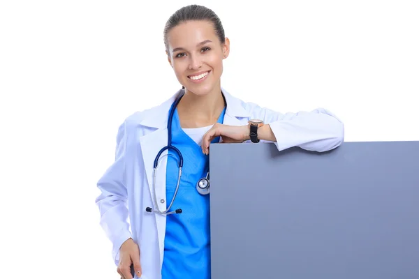 A female doctor with a blank billboard. — Stock Photo, Image