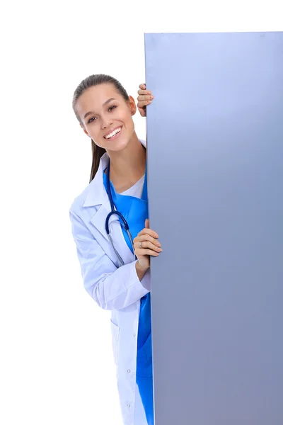 A female doctor with a blank billboard. — Stock Photo, Image