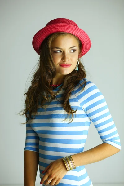 Portrait of young beautiful brunette woman in hat — Stock Photo, Image