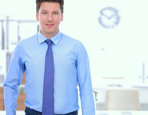 Successful business man standing in office — Stock Photo, Image