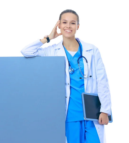 A female doctor with a blank billboard. — Stock Photo, Image