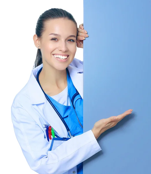 A female doctor with a blank billboard. — Stock Photo, Image