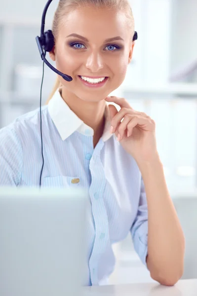 Close-up portrait of a customer service agent sitting at office — Stock Photo, Image