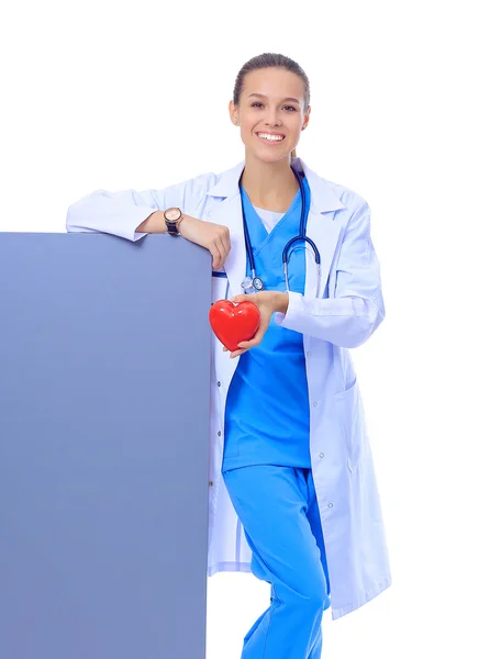 Closeup portrait doctor with stethoscope, holding heart, blank white paper — Stock Photo, Image