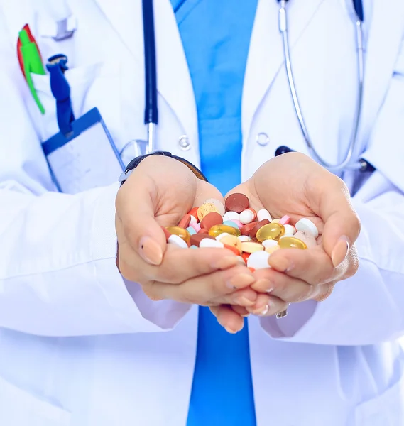 Doctor holding heap of drugs in a hand — Stock Photo, Image