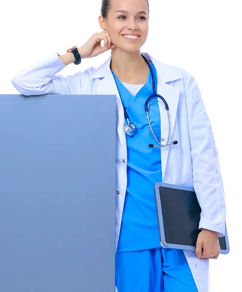 A female doctor with a blank billboard. — Stock Photo, Image