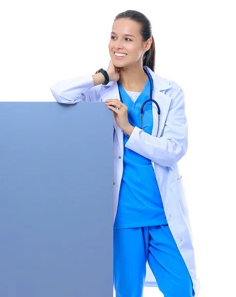 A female doctor with a blank billboard. — Stock Photo, Image