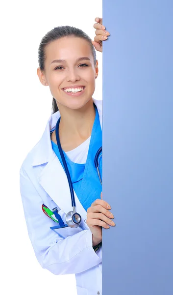 A female doctor with a blank billboard. — Stock Photo, Image