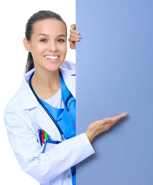 A female doctor with a blank billboard. — Stock Photo, Image