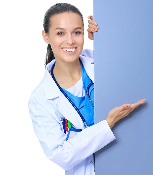 A female doctor with a blank billboard. — Stock Photo, Image