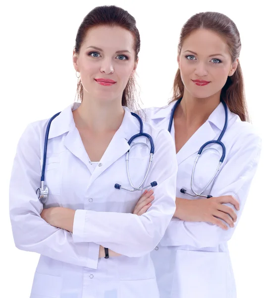 Two young woman doctor , standing in hospital, isolated — Stock Photo, Image