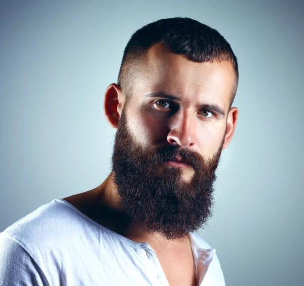 Portrait of handsome man standing, isolated on grey background — Stock Photo, Image