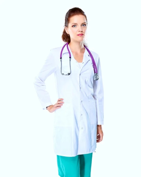 Portrait of young woman doctor with white coat standing in hospital — Stock Photo, Image