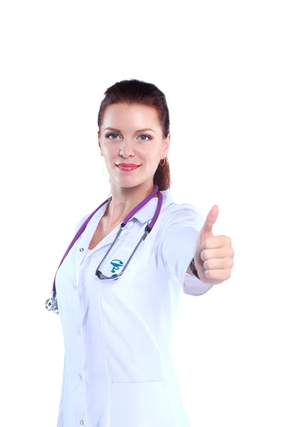 Smiling female doctor in uniform standing at hospital — Stock Photo, Image