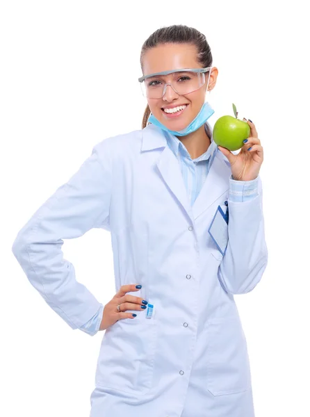 Mulher sorridente médico com uma maçã verde. — Fotografia de Stock