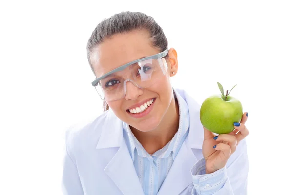 Mulher sorridente médico com uma maçã verde. — Fotografia de Stock