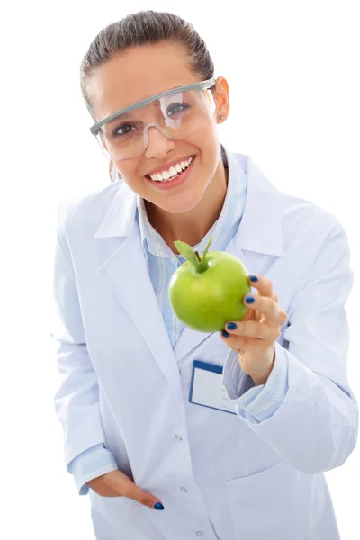 Mulher sorridente médico com uma maçã verde. — Fotografia de Stock