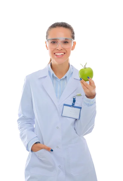 Mulher sorridente médico com uma maçã verde. — Fotografia de Stock