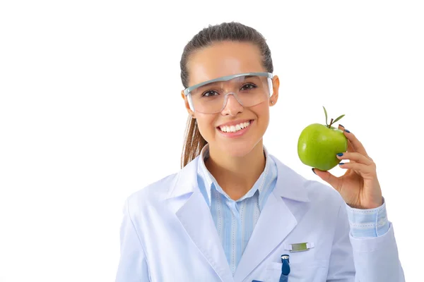 Sorridente medico donna con una mela verde. — Foto Stock