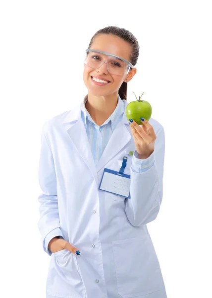 Mulher sorridente médico com uma maçã verde. — Fotografia de Stock