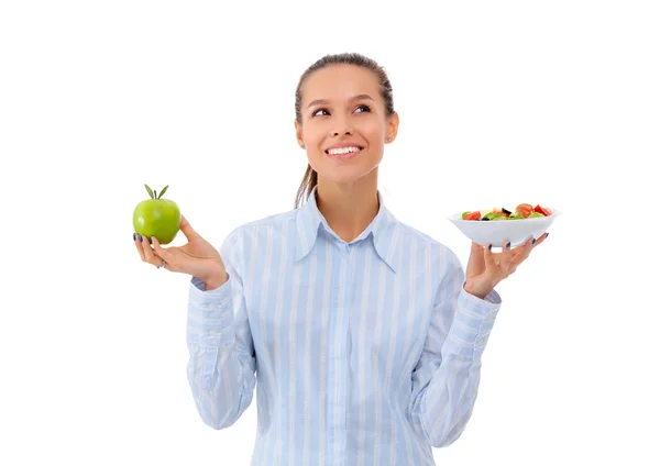 Portret van een mooie vrouw arts met een bord met verse groenten en groene appel — Stockfoto