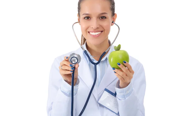 Médico médico mujer examinando manzana con estetoscopio — Foto de Stock