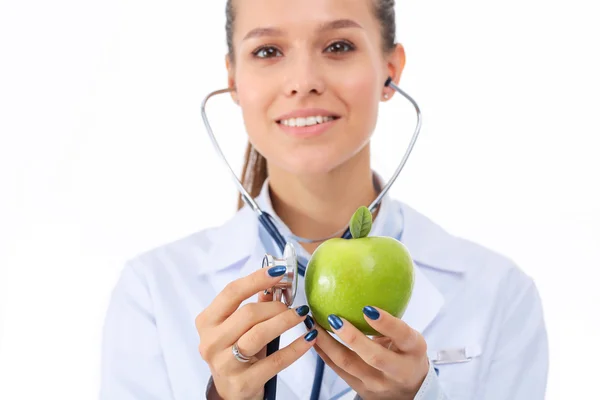 Médico médico mujer examinando manzana con estetoscopio — Foto de Stock