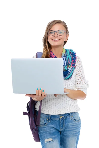 Adolescente sonriente con portátil sobre fondo blanco —  Fotos de Stock