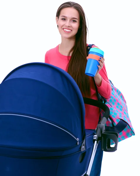 Full length portrait of a mother with a stroller, isolated on white background — Stock Photo, Image